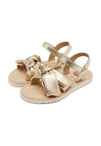 Sandali metallici dorati con design frontale annodato. Presentano una soletta con motivo a stelle rosa e due cinturini regolabili per una vestibilità ottimale.