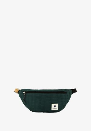 Green textured fanny pack with a black zipper, cork accent, and a white logo patch. Features a compact, curved design for accessibility.