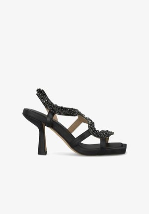Schwarze Sandalen mit Absatz und offener Zehe, ausgestattet mit Perlenverzierungen auf einem gewellten Riemen und einem stabilen Blockabsatz.