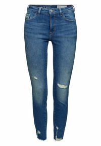 Blå skinny jeans i denim med slitna detaljer och fransade fållar, standard femficksdesign och knappstängning.