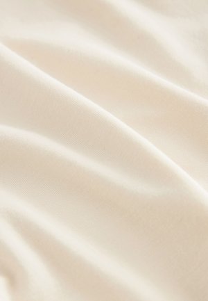 Smooth, off-white fabric with subtle folds and a soft texture, captured in close-up view.