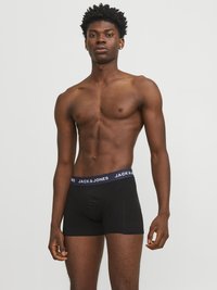 Boxer da uomo neri con una cintura blu navy caratterizzata dal logo "JACK & JONES". Tessuto morbido e design aderente, adatti per un uso confortevole.