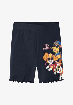 Shorts pour enfants bleu marine avec ourlets volantés, représentant des personnages colorés de la Pat' Patrouille portant des lunettes de soleil et le texte "PAW PATROL" sur la jambe droite.