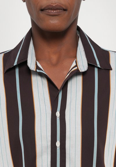Striped shirt featuring vertical lines in blue, orange, and brown on a light gray background; includes a pointed collar and button front.