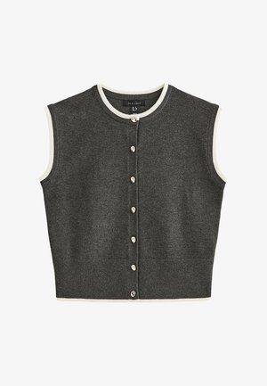 Veste sans manches en tricot gris foncé avec boutons, bordée de blanc au col, aux emmanchures et à l'ourlet.