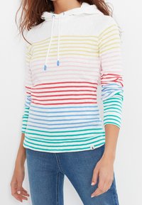 Haut à manches longues avec capuche en tissu doux, avec des rayures horizontales multicolores (jaune, rose, rouge, bleu, vert) et un cordon de serrage ajustable.