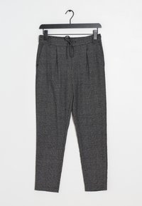 Pantalon gris à carreaux avec une taille élastique, un cordon de serrage et deux poches latérales ; forme fuselée et texture tissée.