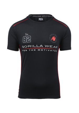 Zwarte sport T-shirt met rode accenten, voorzien van de tekst "Gorilla Wear" en "FOR THE MOTIVATED," en een logo op de borst. Korte mouwen.