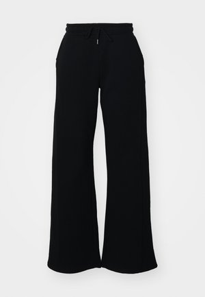 Pantalones deportivos negros con cinturilla ajustable, diseño de pierna ancha y bolsillos laterales. Hechos de tejido suave con una textura lisa.