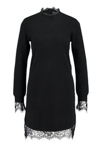 Svart stickad klänning med långa ärmar, med spetsdetaljer vid halsringning och fåll. Mjuk textur, avslappnad passform och subtila slitningar.