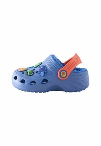 Blue Crocs with fuzzy interior, features multiple colorful decorative charms, back strap for support, ventilated holes, and textured sole.