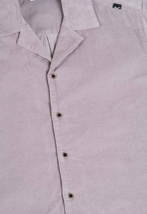 Light purple corduroy shirt featuring a collar, front button placket with black buttons, and a relaxed fit. Subtle ribbed texture.