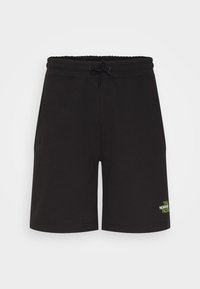 Černé bavlněné kraťasy s elastickým pasem a šňůrkou, s bočními kapsami a zeleným logem na pravé noze.
