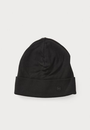 Black beanie hat made of soft fabric with a folded brim. Features a small logo patch on the front and a smooth texture.