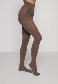 Collant marroni strutturati con motivo a spina di pesce, caratterizzati da una fascia alta in vita, finitura liscia e taglio aderente dalla vita alle dita dei piedi.