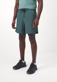 Nike Performance UNLIMITED - Pantalón corto de deporte - vintage green/fir/black