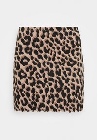 Mini-jurk met luipaardprint in zacht, rekbaar materiaal. Heeft een lichtbeige achtergrond met gedurfde zwarte vlekken. Scalloped zoomdetail.