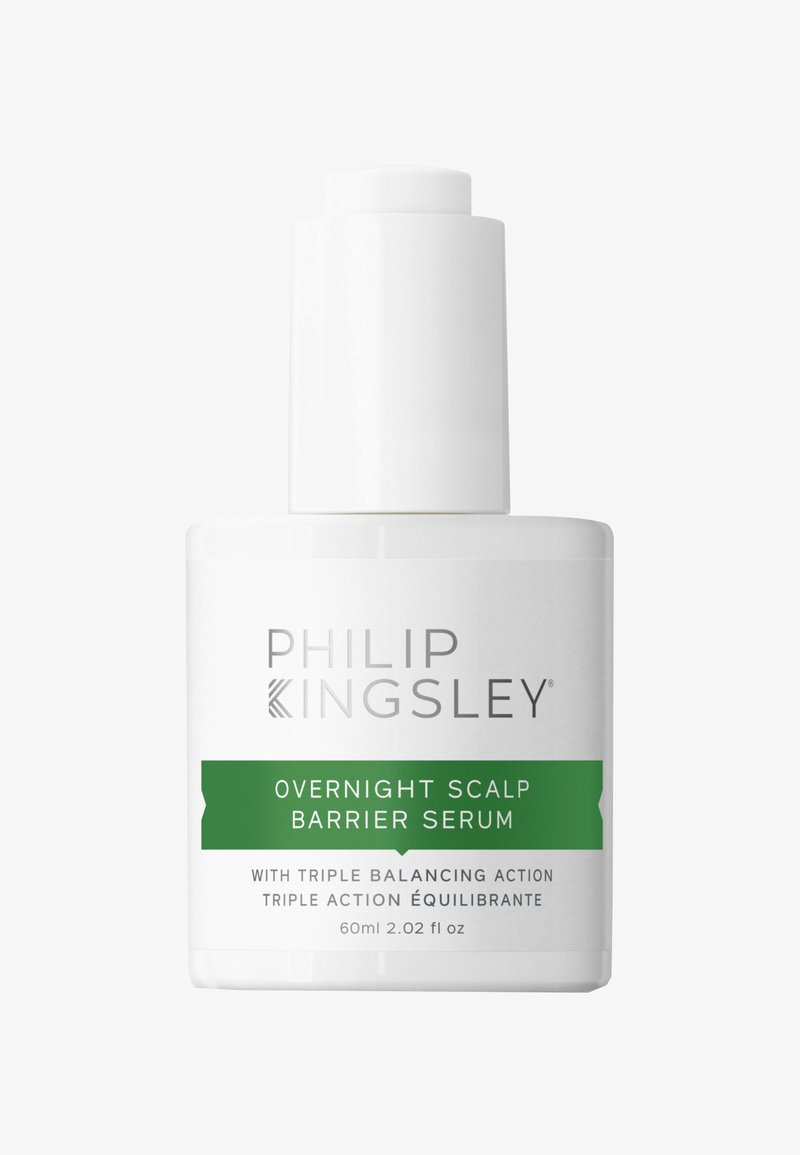 Witte fles met een groene label waarop "Overnight Scalp Barrier Serum" staat, met een pompdeksel en een strak ontwerp, 60 ml capaciteit.
