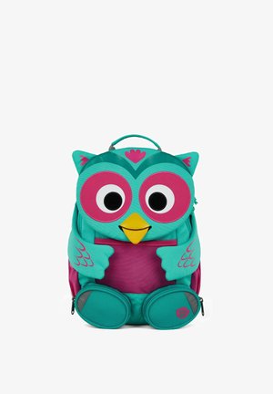 Turquoise and pink owl-shaped children's backpack with large eyes, yellow beak, wing and paw details, and a top carry handle.