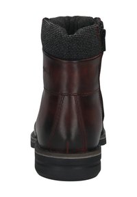 Braune Lederstiefelette mit einem Kragen aus Strickstoff, seitlichem Reißverschluss und einer strukturierten Gummisohle für besseren Grip. Glatte Oberfläche mit kontrastierendem Nähten.