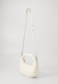 Tommy Jeans PILLOW MINI HOBO - Handbag - offwhite