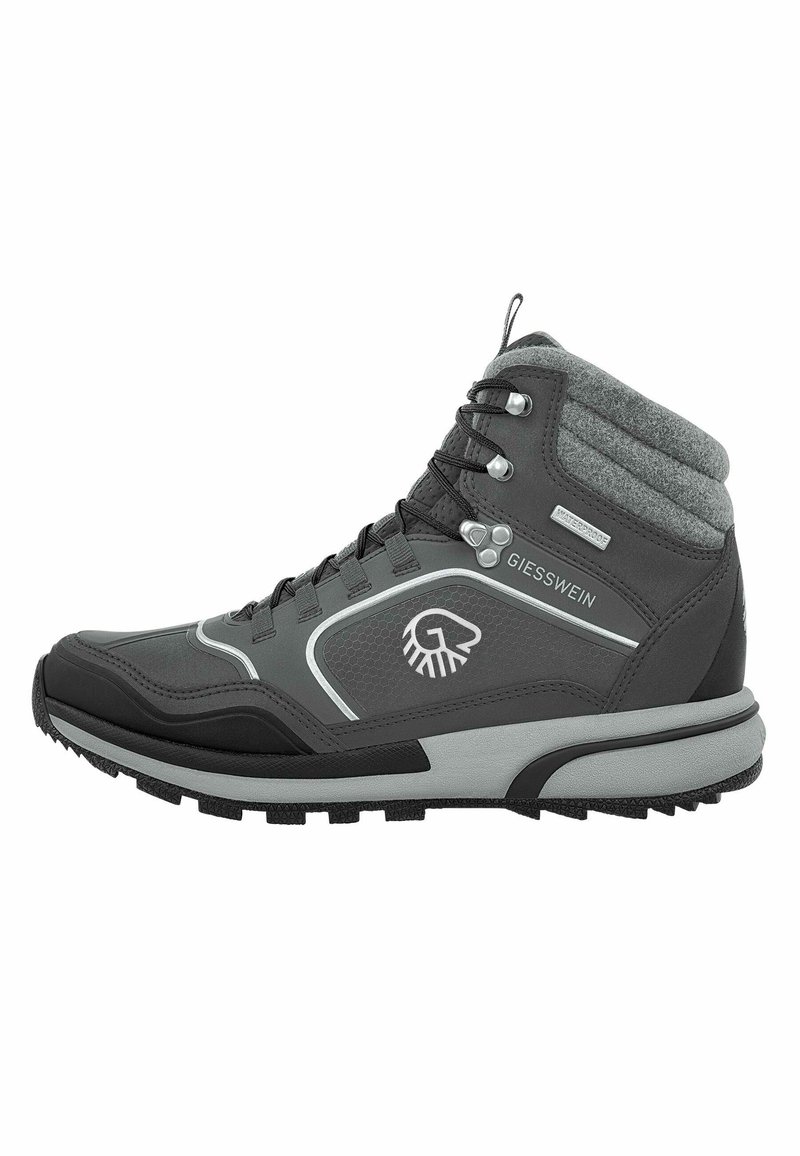 Mid-Cut-Wanderschuhe in Dunkelgrau mit schwarzen Akzenten. Verfügen über ein strukturiertes synthetisches Obermaterial, einen gepolsterten Kragen und eine robuste Gummisohle für guten Halt.