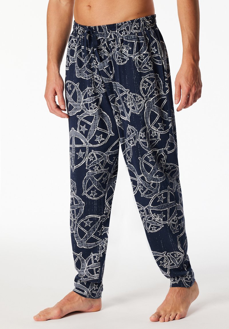 Navy Schlafanzughose mit Kordelzug. Mit einem wiederkehrenden Druck von Sternformen und kreisförmigen Designs in Hellgrau. Weicher Stoff, lockere Passform.