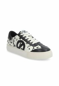 Black and white sneakers featuring a splatter design, leather and textile materials, round toe, white laces, and logo detail on the side.