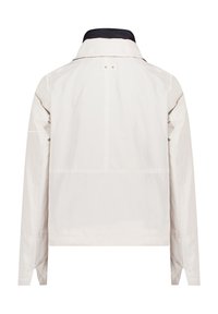 Light beige jacket with a black collar, smooth texture, zip closure, and minimal seam detailing. Features long sleeves and a straight fit.