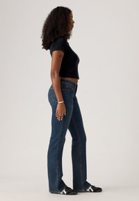 Levi's® SUPERLOW BOOTCUT - Jeans bootcut - sweep down