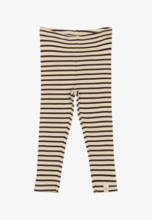 Hladké legíny v béžovej farbe s hnedými horizontálnymi pruhmi. Dôraz je kladený na priliehavý strih a na spodnom leme sa nachádza štítok s logom. Ležérny a pohodlný štýl.