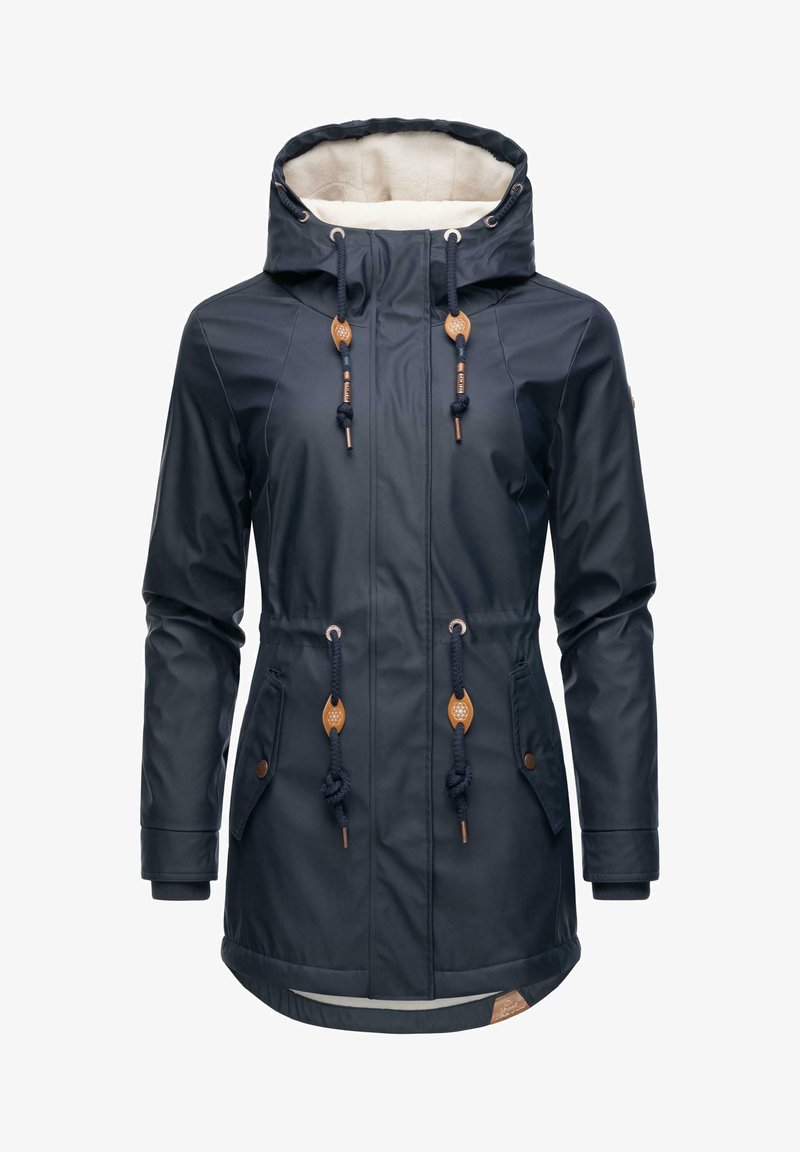 Navy waterproof jacket with a fur-lined hood, adjustable drawstrings, two front pockets, and brown leather accents at the toggles.