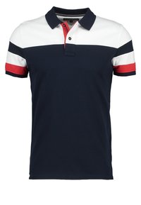 Mörkblå polo-shirt med vita och röda horisontella ränder, krage och knäppning med tre knappar. Korta ärmar med ribbade manschetter. Blandning av bomullstyg.