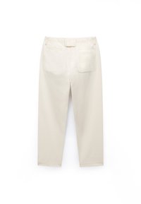 Beige cotton pants with a straight cut, featuring a waistband and two back pockets. The fabric has a smooth texture and minimalistic design.