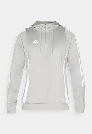Hoodie gris clair avec un col zippé, des rayures blanches et un logo brodé. Fabriqué en tissu athlétique lisse avec une texture douce.