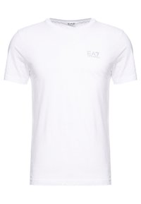 Bílé tričko s krátkými rukávy z bavlny; má malé tónované logo EA7 na levé straně hrudi, kulatý výstřih a standardní střih.