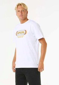 White cotton t-shirt featuring a round neckline, short sleeves, and a graphic design with orange and yellow text. Simple, relaxed fit.