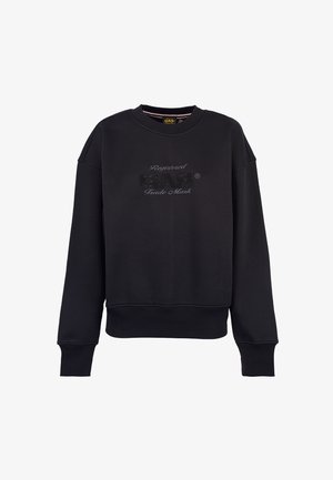 Felpa nera a maniche lunghe con collo a giro, dotata di polsini e fondo a coste, che presenta un testo in rilievo "Marchio Commerciale Registrato GAS" sul davanti.