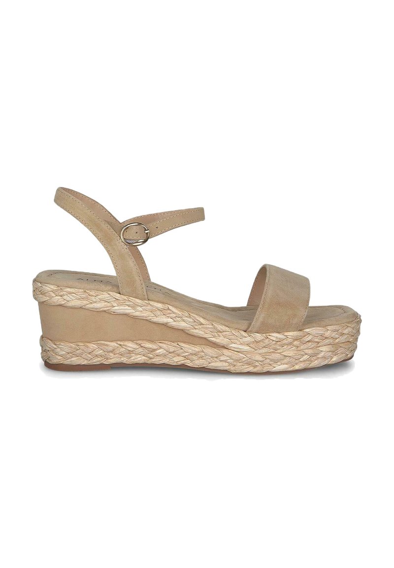 Beige wedge sandals with a braided jute sole, a flat platform, and adjustable ankle strap. Smooth suede upper, open toe design.