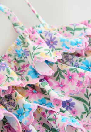 Lillelillebikini, millel on roosad, sinised ja kollased lilled valgel taustal. Omab volangilisi ääri ja õhukesi reguleeritavaid rihmu.