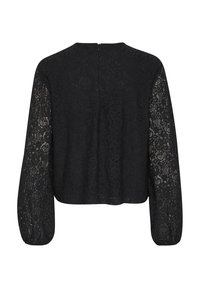 Top in pizzo nero con maniche lunghe e trasparenti, scollatura tonda e cerniera sul retro. Motivo floreale intricato su tutto il tessuto.
