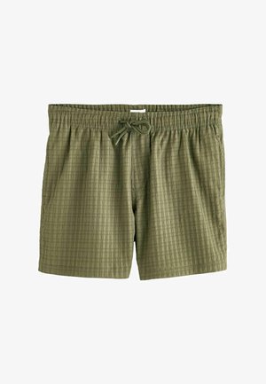 Alyviniai žali maudymosi šortai, pagaminti iš tekstūruoto audinio. Turi elastingą juosmenį su raišteliu ir šoninėmis kišenėmis.