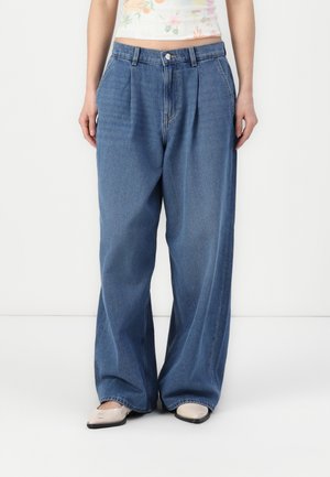 ONLIVY WIDE - Wide leg - medium blue denim