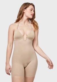 Monosuit de shaper nude con tirantes ajustables, escote en V y parte inferior estilo braga. Material suave y elástico, diseño entallado.
