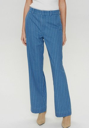 Blue pinstriped wide-leg trousers made from a soft fabric, featuring a comfortable elastic waistband and a smooth texture.
