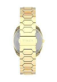 Guldtonet armbåndsur med en hexagonal kæde og et rundt urkasse. Bagsiden har en sølvtonet finish med brandnavnet graveret.