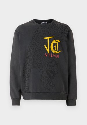 Black sweatshirt featuring a leopard graphic and "JC MILANO" text in yellow and red. Made of soft fabric with ribbed cuffs.
