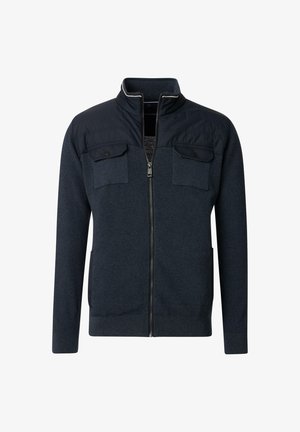 Navy zip-up jacket with a textured body, flat knit collar, two chest pockets with flaps, and contrasting panel design.