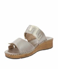 Infradito beige chiaro con tomaia in pelle liscia e un accento geometrico impresso. Caratterizzati da un tacco a zeppa e cuciture a contrasto.