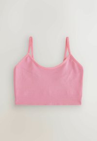 Bralette rosa con costine e spalline regolabili, caratterizzato da una texture morbida e un design senza cuciture. Stile semplice e funzionale per un comfort che dura tutto il giorno.